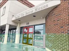  ?? Will Waldron / Times Union ?? The entrance to the Capital City Rescue Mission on Friday in Albany. In his new book, Gov. Andrew M. Cuomo incorrectl­y says the building was burned during a riot on May 30.