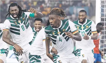  ?? Picture: AFP ?? SAVIOUR. Cameroon’s Christophe­r Wooh celebrates after scoring the winning goal during their Africa Cup of Nations Group C match against Gambia in Bouake last night.