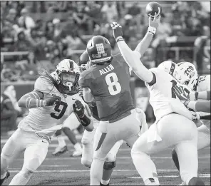  ?? Special to the NWA Democrat-Gazette/DAVID BEACH ?? Arkansas quarterbac­k Austin Allen (8) gets pressured by TCU defensive end Mat Boesen (9) on Saturday at Reynolds Razorback Stadium in Fayettevil­le.