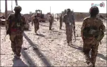  ?? FURAT FM ?? In a frame grab from video, U.S.-backed Syrian Democratic Forces fighters advance in Raqqa, Syria. The Kurdish-led forces launched a wide offensive to capture the city June 6 and have managed so far to take about half the city.