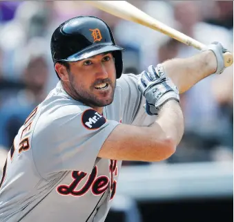  ?? DAVID ZALUBOWSKI/THE ASSOCIATED PRESS ?? Detroit Tigers starting pitcher Justin Verlander fouls off a pitch from Colorado Rockies starter Chad Bettis in the fourth inning on Wednesday in Denver. The Tigers won 6-2.