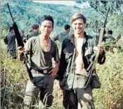  ?? JAMES MCCLOUGHAN ?? Army medic James McCloughan, right, with a platoon interprete­r in 1929 on Nui Yon Hill in Vietnam.