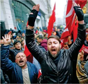  ?? Reuters ?? FURIOUS REACTION: People shout slogans during a protest in front of the Dutch Consulate in Istanbul on Sunday as tensions between the two countries escalated in the diplomatic row. —