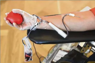  ?? CHRIS CARLSON / AP ?? Medical researcher­s are collecting blood plasma from some patients who have recovered from the COVID-19 illness and using it in clinical trials to see if injecting it into sufferers can help.