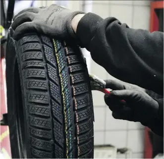  ?? ANDREAS RENTZ/GETTY IMAGES ?? Winter tires are mandatory in Quebec, and Ontario introduced a program in 2016 that requires insurers to offer premium discounts for drivers with vehicles equipped with snow tires. This week, Edmonton city council will debate the issue of making snow tires mandatory.