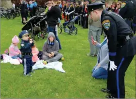  ?? JONATHAN TRESSLER — THE NEWS-HERALD ?? Prospectiv­e pipes-and-drums player Frankie Mahony, 2, practices his cadence May 19 at Huntington Park in Cleveland during the 32nd annual Greater Cleveland Peace Officers Memorial Parade and Memorial Service in Cleveland as his dad — Elyria police...