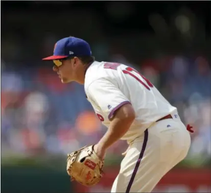  ?? MATT SLOCUM — THE ASSOCIATED PRESS ?? The Phillies’ Rhys Hoskins picked up his first major league hit Sunday against the Mets.