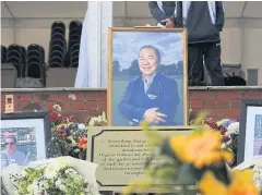  ?? AFP ?? A photograph of Vichai Srivaddhan­aprabha is displayed at his memorial garden.