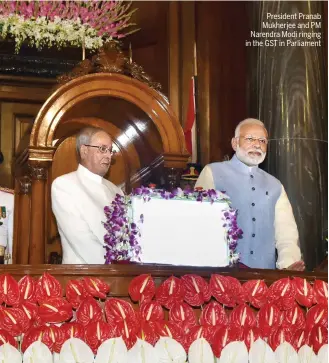  ??  ?? President Pranab Mukherjee and PM Narendra Modi ringing in the GST in Parliament