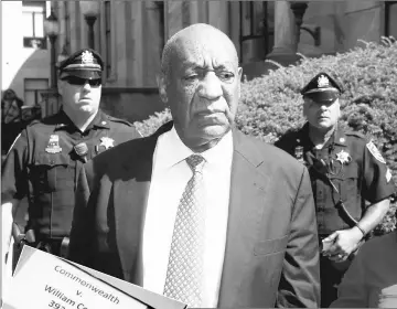  ?? — Reuters photos ?? Cosby departs after the fifth day of his sexual assault trial at the Montgomery County Courthouse in Norristown, on Friday. (Inset) Legal documents are wheeled into the courtroom during the trial.