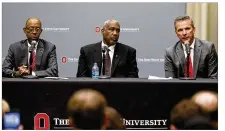  ?? PAUL VERNON / AP ?? Ohio State football coach Urban Meyer (right) answers questions as university President Michael Drake (left) and athletic director Gene Smith listen during a news conference Wednesday.