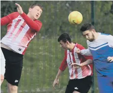  ??  ?? Aerial scrap: AFC Donkins (red and white) battle Willow Pond last week.