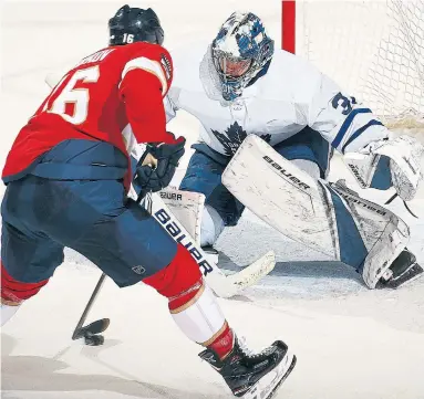  ?? ELIOT J. SCHECHTER GETTY IMAGES ?? The Panthers’ Aleksander Barkov scores the overtime winner against Frederik Andersen. It was Barkov’s third of the night.