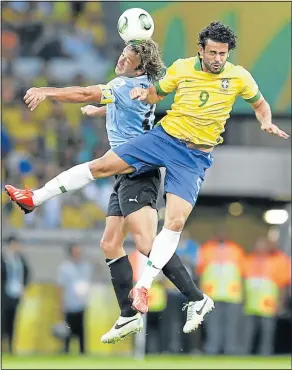  ?? Picture: REUTERS ?? SEEING IS BELIEVING: Brazil’s Fred, right, fights for the ball with Uruguay’s Diego Lugano Confederat­ions Cup semfinal in Belo Horizonte on Wednesday. Brazil won 2-1
during
their