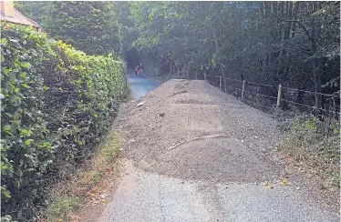  ?? Picture: INS ?? The lane in Beaconsfie­ld is cut off yesterday after a fly-tipper dumped a load of soil and debris