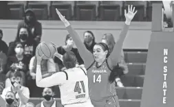  ?? KARL B. DEBLAKER/AP ?? Georgia’s Jenna Staiti, top, pressures North Carolina State’s Camille Hobby during the first half Thursday in Raleigh, N.C.