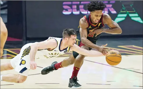  ??  ?? Left: Indiana Pacers’ T.J. McConnell, (left), and Cleveland Cavaliers’ Collin Sexton reach for the ball during the first half of an NBA basketball game Wednesday, March 3 , in Cleveland. Right: Brooklyn Nets’ James Harden drives to basket for a layup past Houston Rockets’ Ben McLemore, (left), during the second quarter of an NBA basketball game in Houston. (AP)