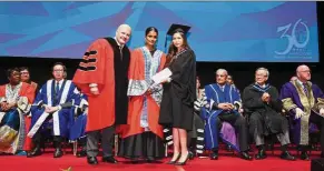  ??  ?? The Datuk Shyamala Alagendra Prize winner Tan Yuan Ling (right) receiving the internship award letter from Datuk Shyamala, which allows her to do her internship in The Hague.