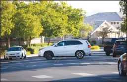  ?? ?? A driver makes an illegal U-turn Oct. 14 on Pinewood Hills Drive near Becker Middle School. CCSD police officers say U-turns are just a portion of the traffic violations officers see on a daily basis around the district’s schools.