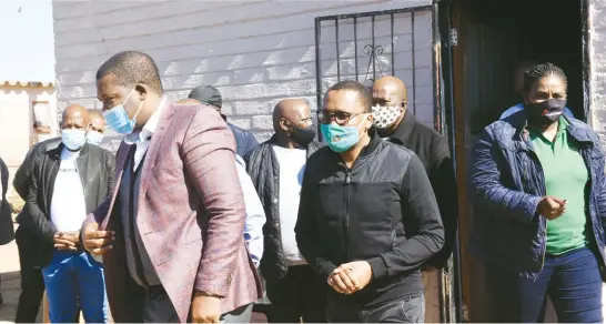  ?? Picture: Nigel Sibanda ?? PAYING HIS RESPECTS. Gauteng MECs Panyaza Lesufi, left, yesterday leaves the family of a Grade 7 pupil from Kokosi Primary School who died on Thursday last week.