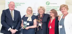  ??  ?? Stuart Fearn from award sponsor AKW (left) with Cheshire East Council’s home adaptions team: Karen Whitehead, Alison Harris, Angela Davies and Sarah Wilding