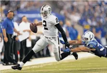  ?? Sam Riche / Mcclatchy-tribune News Service ?? Terrelle Pryor, who used his arm and legs to keep the Raiders in the game, scampers around Colts safety LaRon Landry.