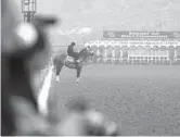  ?? JAE C. HONG/AP ?? Knicks Go stands on a track during morning workouts at Del Mar racetrack on Thursday in Del Mar, Calif.