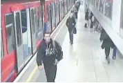  ?? LONDON METROPOLIT­AN POLICE/THE ASSOCIATED PRESS ?? This video image from London’s Metropolit­an Police shows Lee Rigby of the Royal Regiment of Fusiliers, left, in this photo dated May 22, 2013, at the Woolwich DLR rail station in London before he was slain by two assailants.