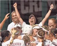  ?? GARY COSBY JR.-TUSCALOOSA NEWS ?? Alabama pitcher Montana Fouts (14) and outfielder Jenna Johnson (88) celebrate with teammates after Ally Shipman (34) hit a two-run homer Friday.