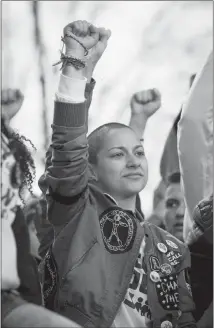  ?? ERIN SCHAFF / THE NEW YORK TIMES ?? Emma González and other student activists from Parkland, Fla., are shown onstage March 24 at the end of the March for Our Lives rally in Washington. For many observers, Gonzalez’s buzz cut is indelibly linked to her advocacy for gun control.