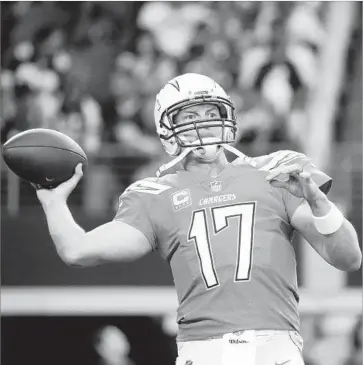  ?? Michael Ainsworth Associated Press ?? THE CHARGERS’ Philip Rivers has passed for 48,781 yards in regular-season NFL games. Although there were once concerns about his throwing technique, coaches agreed not to mess with what worked.