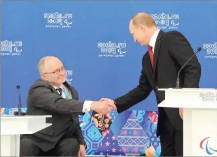  ?? MICHAEL KLIMENTYEV/RIA NOVOSTI ?? Russian President Vladimir Putin (right) shakes hands with IPC president Philip Craven at a meeting in Sochi on March 13, 2014. A ban on Russian athletes competing in the 2016 Rio Paralympic­s was upheld by CAS on Tuesday.