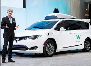  ?? AP/PAUL SANCYA ?? In this January photo, CEO of Waymo John Krafcik introduces a Chrysler Pacifica hybrid, outfitted with Waymo’s sensors and radar, at the North American Internatio­nal Auto Show in Detroit.