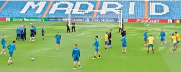  ??  ?? — AP APOEL Nicosias players train in the Santiago Bernabeu stadium in Madrid, Spain, on Tuesday.