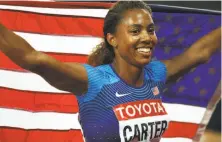  ?? Patrick Smith / Getty Images ?? Kori Carter celebrates after winning the women’s 400-meter hurdles final at London Stadium, leading a 1-2 U.S. finish.