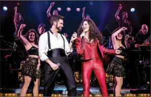  ??  ?? Mauricio Martinez plays Emilio Estefan with Christie Prades as Gloria Estefan in On Your Feet!, onstage this week at Fayettevil­le’s Walton Arts Center.