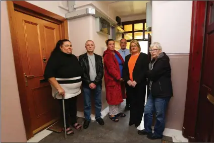  ??  ?? Councillor Elaine McDougall, second from right, pictured with residents of Milnbank housing associatio­n in the East End