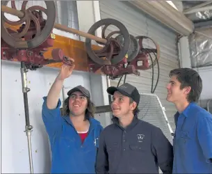  ??  ?? SKILLS SESSION: Longerenon­g College students, from left, Jack Scott, Hugh Nelson and Charlie Gardner learn how to maintain shearing equipment.
Picture: PAUL CARRACHER