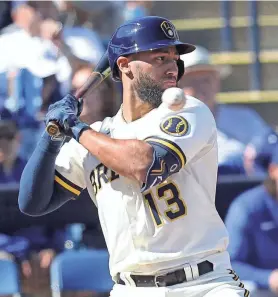  ?? ROY DABNER / FORTHE JOURNAL SENTINEL ?? Abraham Toro stays away from a high pitch during the Brewers’ spring training game Sunday against the Dodgers.