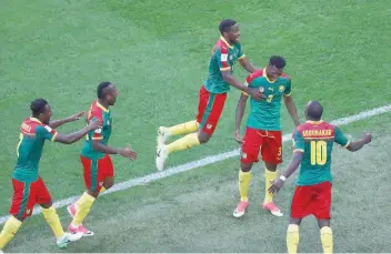  ?? — Reuters ?? Cameroon’s Andre-Frank Zambo Anguissa celebrates scoring their first goal with team-mates.