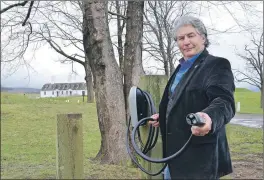  ??  ?? Annapolis Royal Mayor Bill Macdonald stands in front of Fort Anne where the town’s first two electric car charging stations were installed this week. Tesla paid for the installati­on and the charging station itself. The town will cover the cost of...