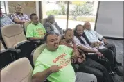  ?? BEN WEAR / AMERICAN-STATESMAN ?? John Solomon, a Yellow Cab driver wearing a shirt that says “support due process,”was among several dozen cabbies at City Hall Thursday.