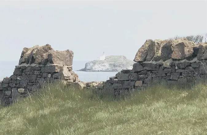  ??  ?? 0 Reader Graeme Brown contribute­s this photograph showing a framed view of Fidra Lighthouse taken on a walk along Renaissanc­e golf course’