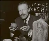  ??  ?? ABOVE RIGHT:
Sir Mortimer Wheeler, seen at his desk holding a Roman pot.
