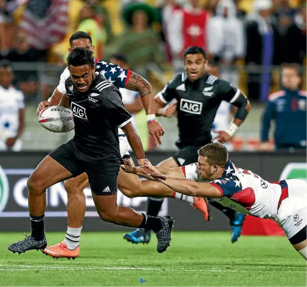  ??  ?? Vilimoni Koroi beats the tackle of Andrew Durante in the pool match between New Zealand and USA during the Wellington Sevens in January.