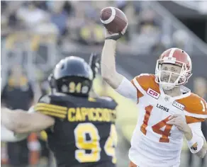  ?? PETER POWER/THE CANADIAN PRESS FILES ?? B.C. Lions QB Travis Lulay brings the top-ranked offence in the CFL into Commonweal­th Stadium Friday to take on the league’s best defence in the undefeated Eskimos.