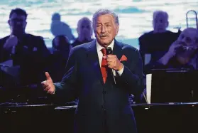  ?? Evan Agostini / Associated Press 2019 ?? Tony Bennett performs at the Statue of Liberty Museum opening celebratio­n in 2019. Bennett recently announced he had been diagnosed with Alzheimer’s.