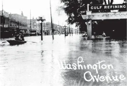  ??  ?? Washington Ave, the main street of Greenville, Mississipp­i, was accessible only by boat after the catastroph­ic levee break of April 1927.