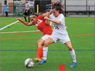  ?? PHOTOS BY AUSTIN HERTZOG — DIGITAL FIRST MEDIA ?? Perkiomen Valley’s Kelsey Marino, left, gets tied up with Pottsgrove’s Hannah Phillips as they compete for the ball during Monday’s game.