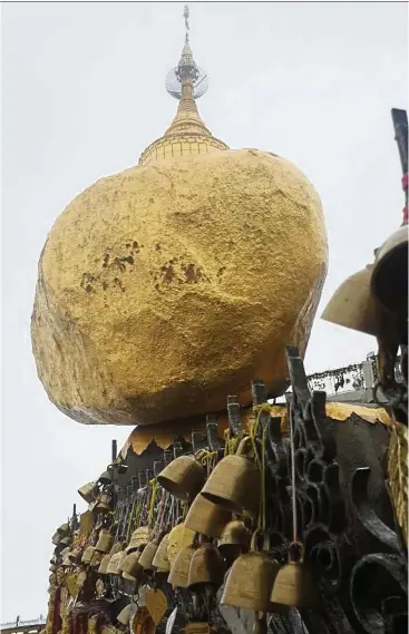  ??  ?? The Golden Rock is perched precarious­ly on the edge of a cliff in Mount Kyaiktiyo, Myanmar. — Photos: T. SELVA/The Star